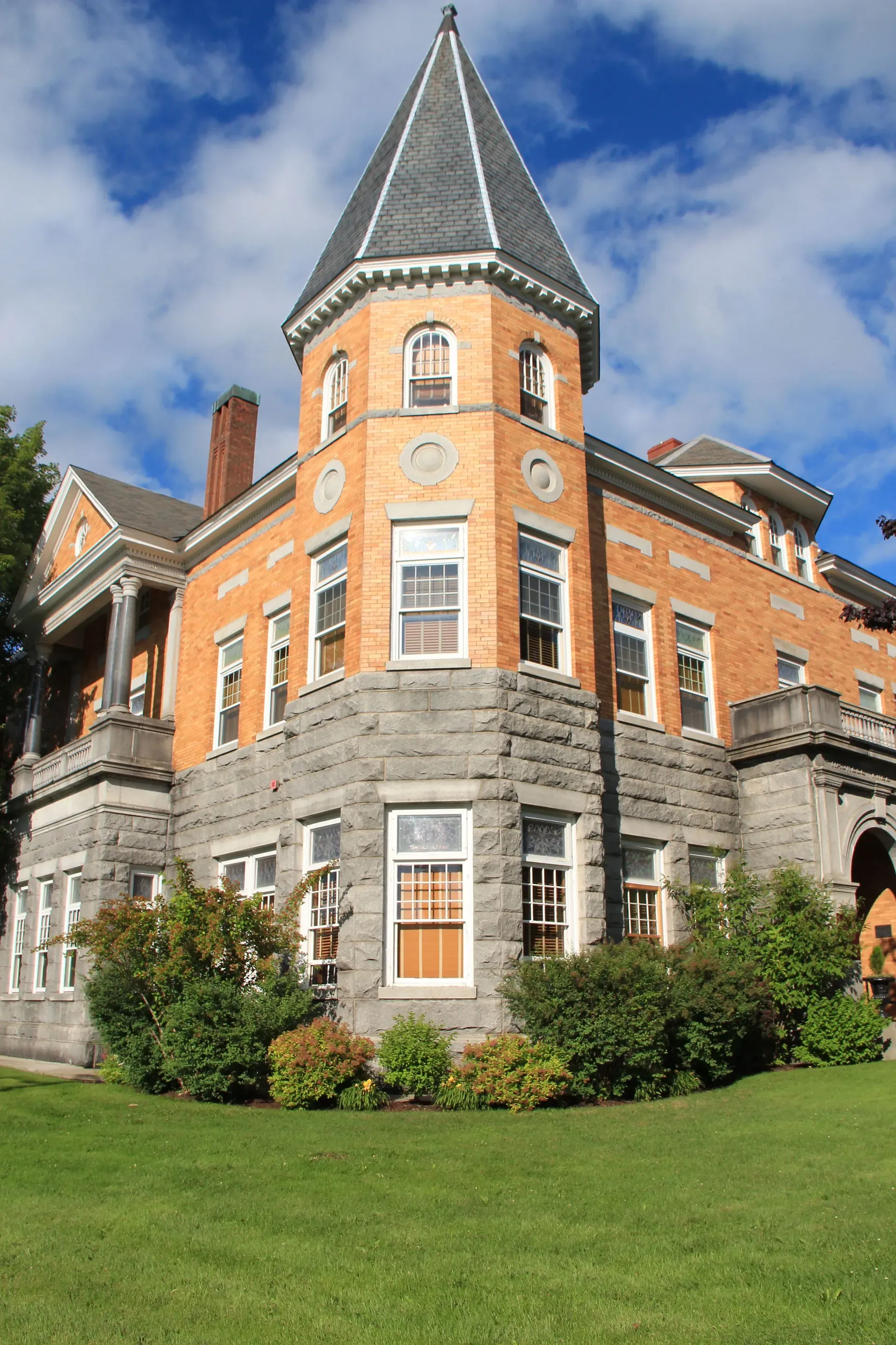 The red brick and granite library and opera house, with a tower at its corner
