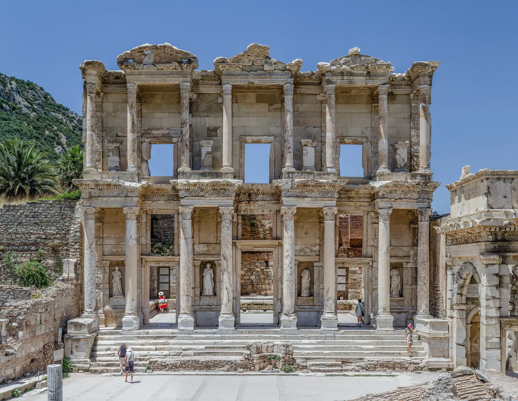 The reconstructed two-storey marble façade of the Library of Celsus at Ephesus, with paired columns and statues standing in niches