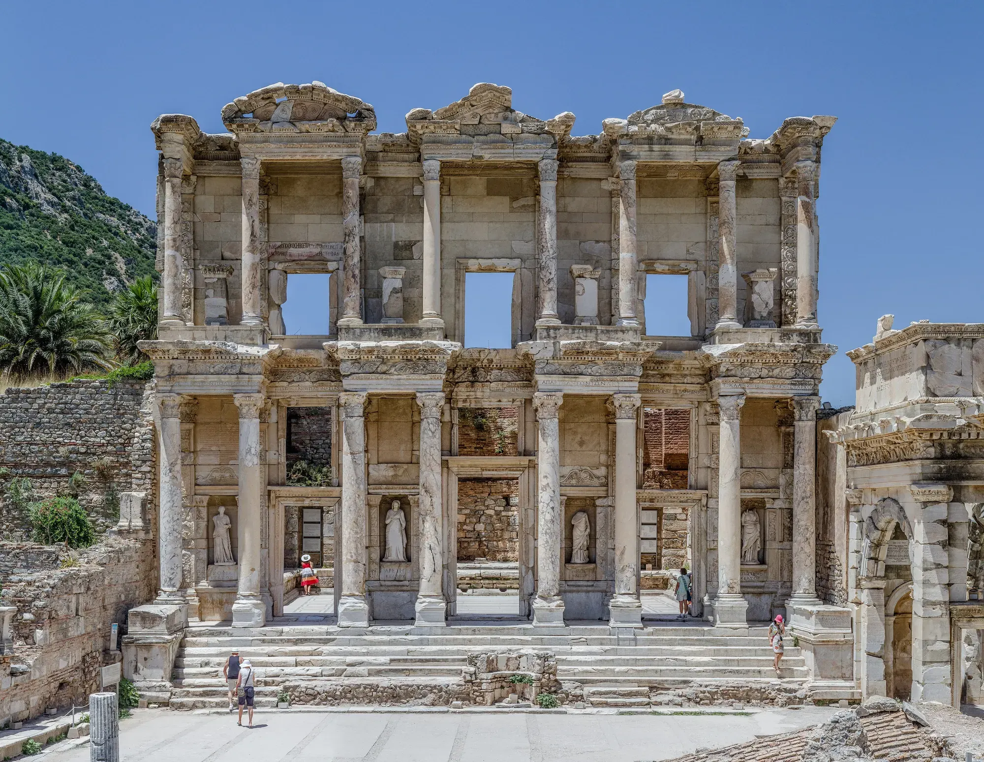The reconstructed two-storey marble façade of the Library of Celsus at Ephesus, with paired columns and statues standing in niches