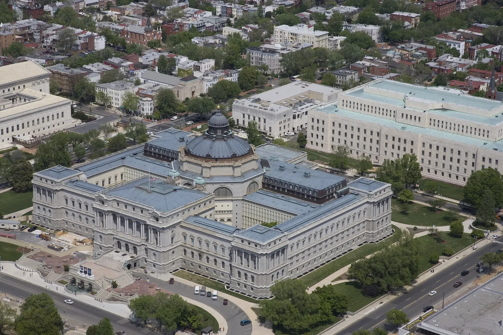 An aerial view of the Thomas Jefferson Building in Washington, its green-roofed dome among other government buildings